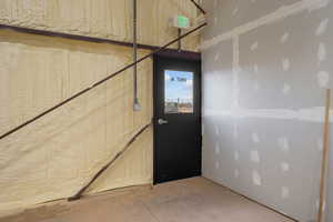 Doorway to outside with concrete floors