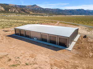 Aerial view of sparsely populated area featuring a mountainous background