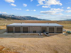 View of outdoor structure featuring a mountain view and a view of countryside