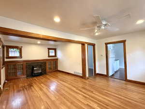 Unfurnished living room with recessed lighting, plenty of natural light, light wood finished floors, and ceiling fan