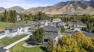 Aerial perspective of suburban area with a mountain backdrop