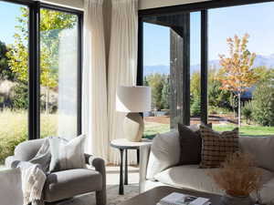 Sunroom / solarium with a mountain view