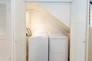 Washroom with washing machine and clothes dryer