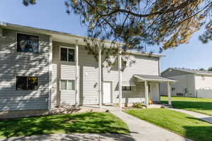View of front of house featuring a front lawn
