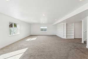 Basement featuring carpet, recessed lighting, and stairs. Built in Shelving...