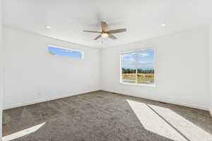 Primary Suite featuring carpet floors, plenty of natural light, recessed lighting, and ceiling fan