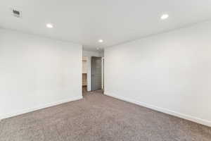 Unfurnished bedroom featuring recessed lighting and carpet