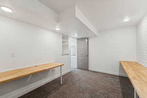 Unfurnished office or ? room featuring dark colored carpet and recessed lighting