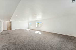 Family Room with carpet floors, a textured ceiling, and recessed lighting