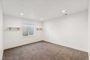 Unfurnished  Bedroom room with carpet floors and recessed lighting