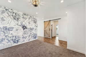 Empty room featuring carpet floors, recessed lighting