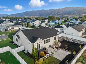 Aerial perspective of suburban area featuring a mountain backdrop