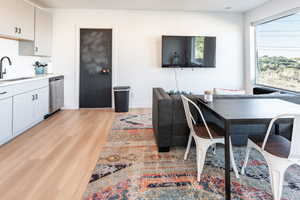 Dining space with light wood-type flooring