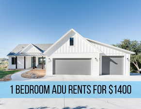 View of front of property with board and batten siding, covered porch, driveway, and a shingled roof