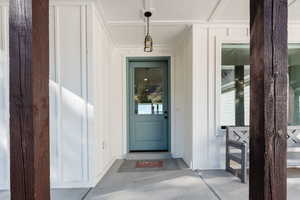 View of exterior entry with board and batten siding