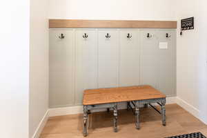 Mudroom featuring light wood finished floors