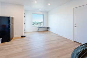 Unfurnished dining area featuring recessed lighting and light wood finished floors