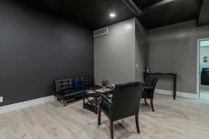 Living area with light wood finished floors