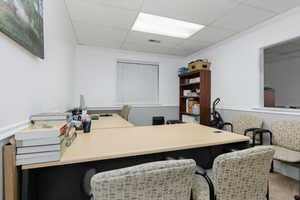 Office space featuring a paneled ceiling