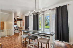 Dining area featuring wood-type flooring and recessed lighting