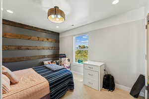 Bedroom with recessed lighting and light wood-style floors