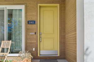 Property entrance with stucco siding