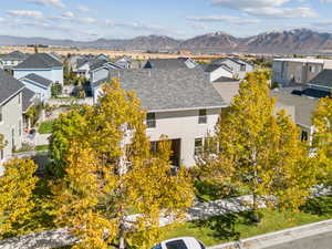 Aerial perspective of suburban area featuring a mountainous background