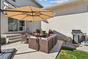 View of patio featuring outdoor lounge area and grilling area