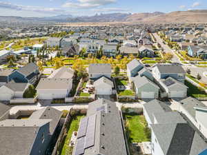 Aerial perspective of suburban area with a mountain backdrop