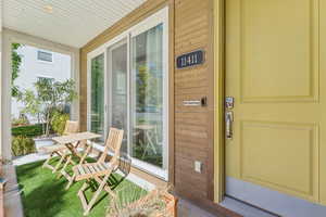 Property entrance with covered porch