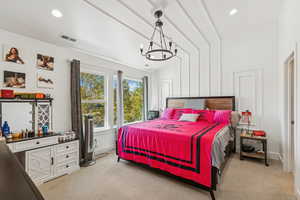 Bedroom featuring vaulted ceiling, light colored carpet, a chandelier, and recessed lighting