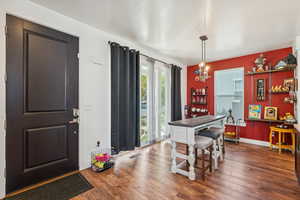 Dining area with hardwood / wood-style floors