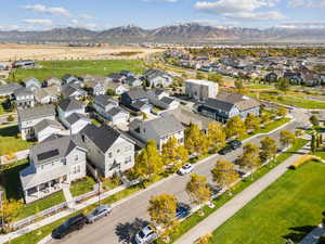 Aerial perspective of suburban area featuring a mountainous background