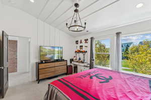 Bedroom with lofted ceiling, light colored carpet, and recessed lighting