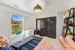 Bedroom featuring a closet, carpet flooring, and recessed lighting