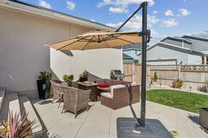 View of patio / terrace featuring an outdoor living space with a fire pit and area for grilling