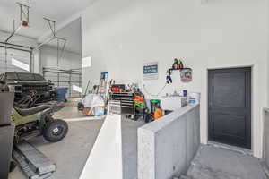 Garage with a sink and a garage door opener