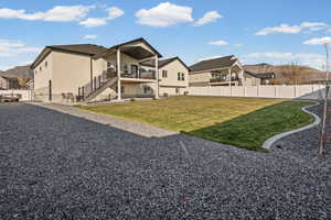 Back of house featuring a patio, a fenced backyard, a mountain view, and stairway