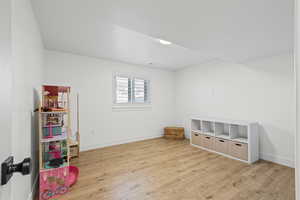 Playroom with light wood finished floors