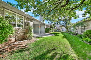 Beautiful wrought iron fence at front provides security and allows for full view of the landscape.