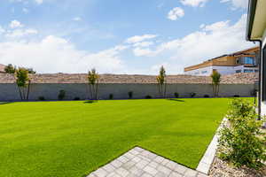 View of fenced backyard