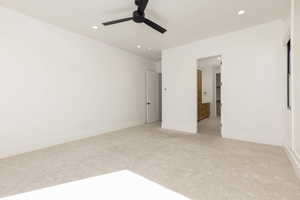 Unfurnished bedroom with recessed lighting, light carpet, connected bathroom, and ceiling fan