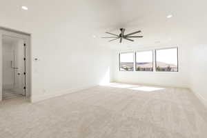 Spare room with light colored carpet, recessed lighting, and ceiling fan