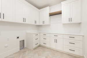 Laundry room featuring electric dryer hookup and washer hookup