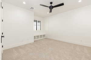 Unfurnished room featuring recessed lighting, light colored carpet, and a ceiling fan
