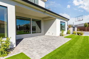 Back of property with a patio area and stucco siding