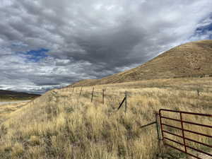 View of mountain background featuring rural landscape