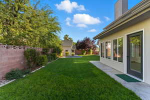 Fenced backyard with a patio