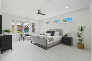 Bedroom with multiple windows, light carpet, a ceiling fan, and recessed lighting