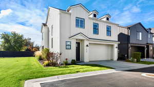 Modern farmhouse style home with board and batten siding, concrete driveway, and an attached garage